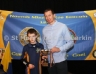 Calum Condron receives the SW U10 Football Cup from Club – School Liaison Officer Paul Doherty